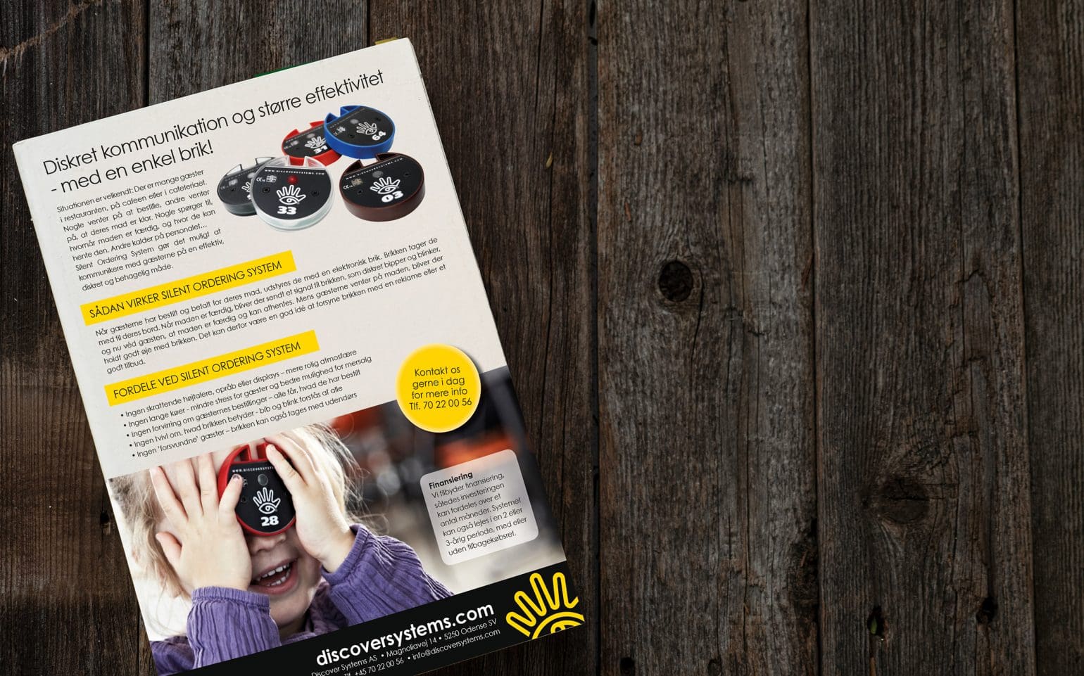 beskrivning av tyst beställningssystem från discover systems på något som ser ut som en tidningsmapp